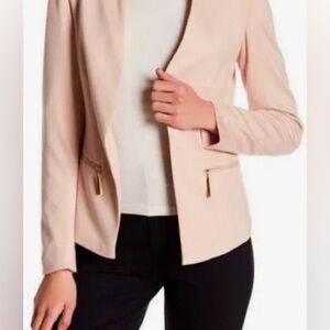 Carmen Marc Valvo blazer light pink/nude with gold zipper pockets.